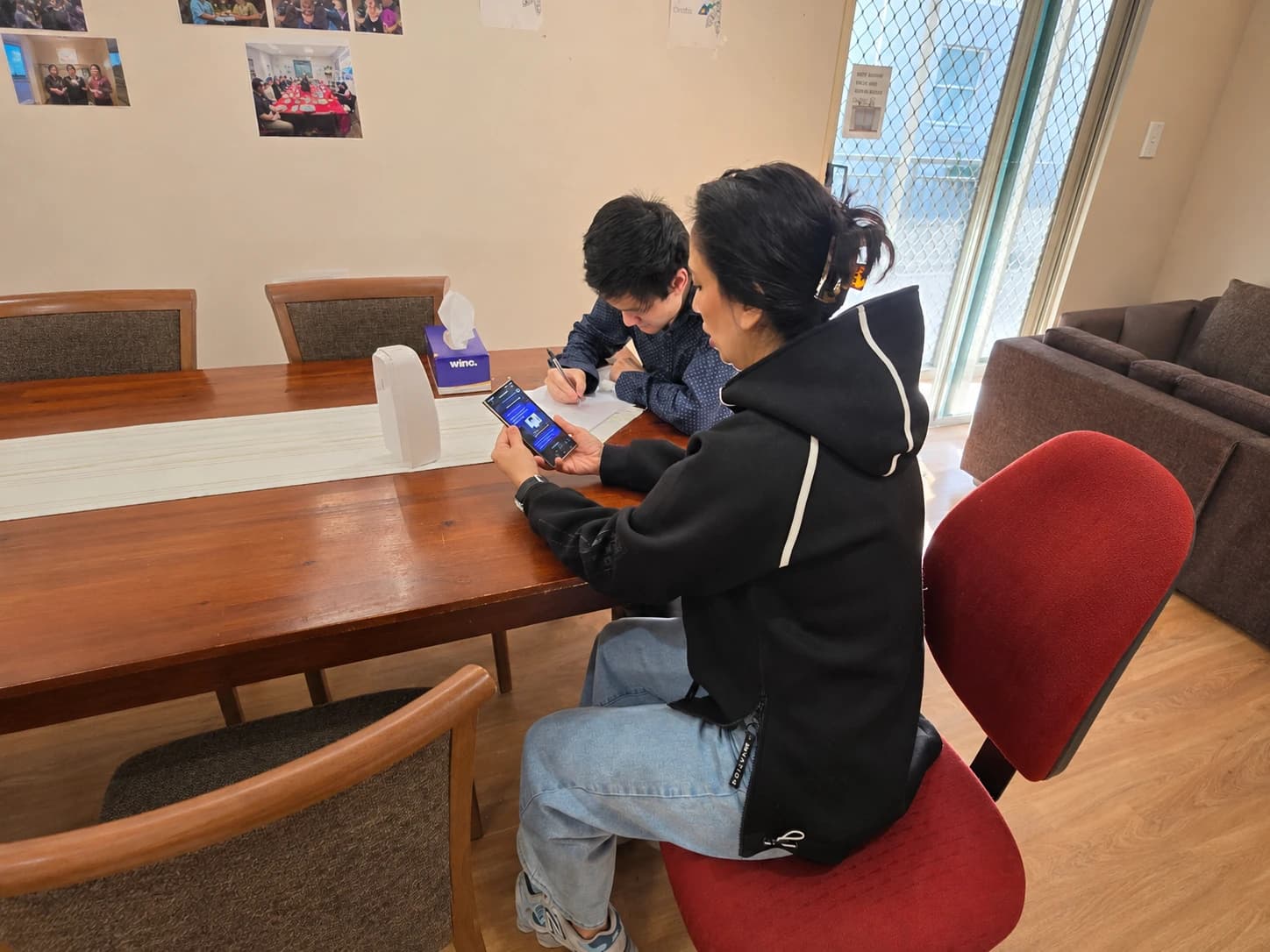 Participant working on learning goals with one-to-one support at home